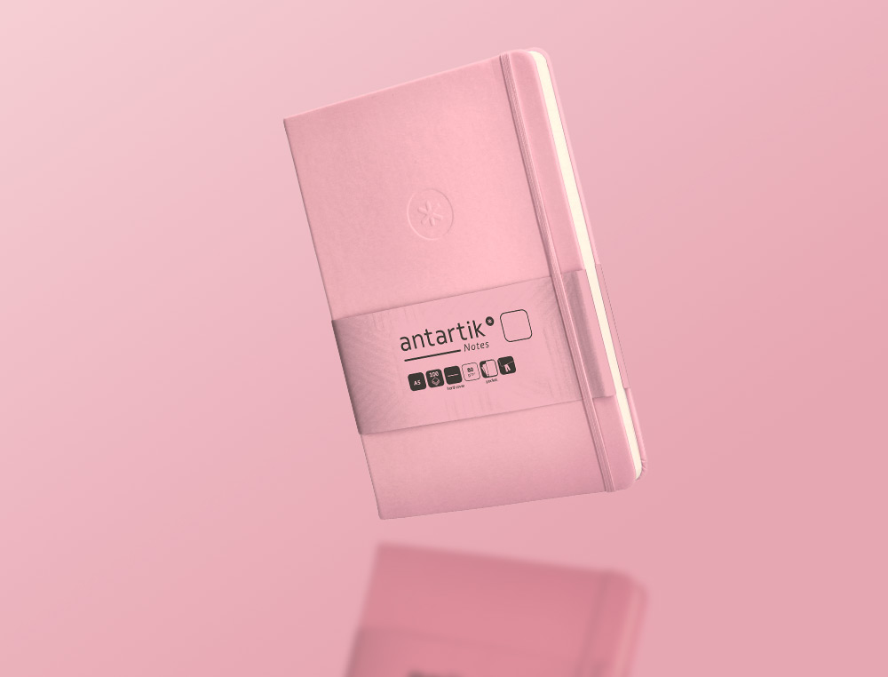 CUADERNO CON GOMILLA ANTARTIK NOTES TAPA DURA A5 HOJAS LISAS ROSA PASTEL 100 HOJAS 80 GR FSC